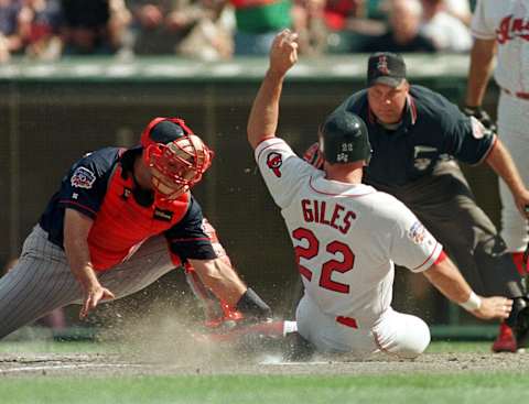 CLEVELAND, OH – SEPTEMBER 28: Minnesota Twins catcher Terry Steinbach (L) makes the tag on Cleveland Indians leftfielder Brian Giles in the third inning of the final game of regular season play 28 September at Jacobs Field in Cleveland, OH. Home plate umpire Brian O’ Nora makes the call. The Indians will travel to New York 30 September to face the New York Yankees in game one of the American League divisional playoffs. (Photo credit should read KIMBERLY BARTH/AFP via Getty Images)