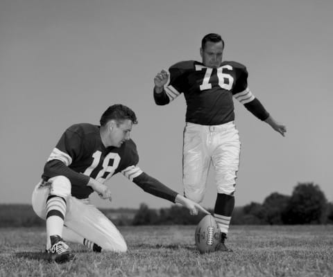 HIRAM, OH – JULY, 1960: Offensive Tackle and Placekicker Lou Groza #76, of the Cleveland Browns, poses for an action portrait during training camp in July, 1960 at Hiram College in Hiram, Ohio. Quarterback Len Dawson #18 is the holder. (Photo by: Henry Barr Collection/Diamond Images/Getty Images)