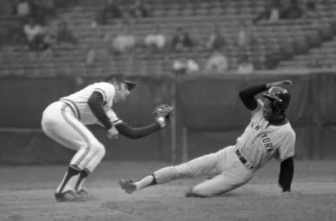 CLEVELAND – MAY 17: (L to R) Shortstop Duane Kuiper, of the Cleveland Indians, receives the throw from the catcher and prepares to tag Paul Blair, of the New York Yankees, trying to steal secondbase during a game on May 17, 1978 at Municipal Stadium in Cleveland, Ohio (Photo by: Ron Kuntz Collection/Diamond Images/Getty Images)