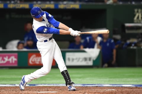 TOKYO, JAPAN – MARCH 12: Tyler Krieger #22 of Israel reaches on a fielding error by third baseman Yurisbel Gracial #47 of Cuba in the fifth inning during the World Baseball Classic Pool E Game One between Cuba and Israel at Tokyo Dome on March 12, 2017 in Tokyo, Japan. (Photo by Matt Roberts/Getty Images)