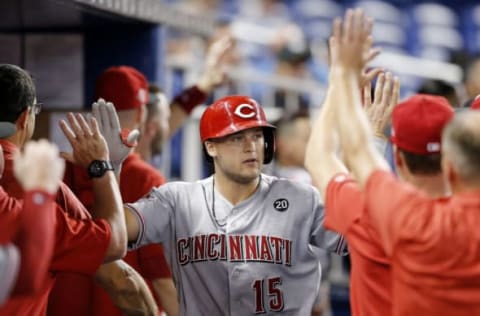 MIAMI, FLORIDA – AUGUST 27: Nick Senzel #15 of the Cincinnati Reds celebrates with teammates after hitting a two-run home run in the sixth inning against the Miami Marlins at Marlins Park on August 27, 2019 in Miami, Florida. (Photo by Michael Reaves/Getty Images)