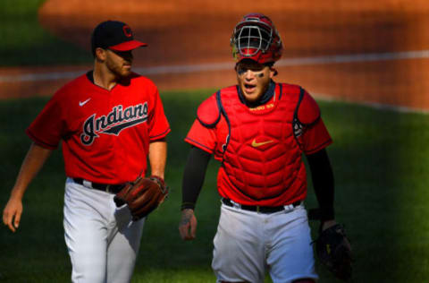 CLEVELAND, OHIO – JULY 28: Starting pitcher Aaron Civale #43 talks with catcher Roberto Perez #55 of the Cleveland Indians as they walk off the field after the top of the fourth inning of game 1 of a double header against the Chicago White Sox at Progressive Field on July 28, 2020 in Cleveland, Ohio. (Photo by Jason Miller/Getty Images)