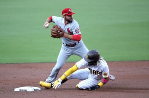 SAN DIEGO, CALIFORNIA – OCTOBER 01: Paul DeJong #11 of the St. Louis Cardinals turns a double play as Fernando Tatis Jr. #23 of the San Diego Padres is out at second base pitches during the first inning of Game Two of the National League Wild Card Series at PETCO Park on October 01, 2020 in San Diego, California. (Photo by Sean M. Haffey/Getty Images)