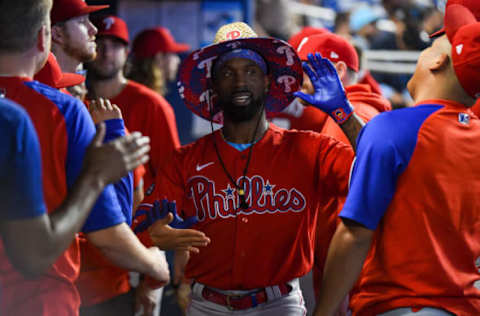 MIAMI, FLORIDA – OCTOBER 03: Andrew McCutchen #22 of the Philadelphia Phillies is congratulated by teammates after hitting a home run during the third inning against the Miami Marlins at loanDepot park on October 03, 2021 in Miami, Florida. (Photo by Eric Espada/Getty Images)