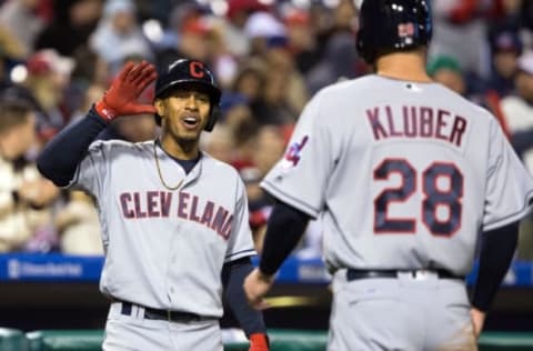 Apr 29, 2016; Philadelphia, PA, USA; Cleveland Indians starting pitcher Corey Kluber (28) is congratulated by shortstop Francisco Lindor (12) after scoring during the fifth inning against the Philadelphia Phillies at Citizens Bank Park. Mandatory Credit: Bill Streicher-USA TODAY Sports