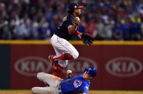 Nov 2, 2016; Cleveland, OH, USA; Cleveland Indians shortstop Francisco Lindor (12) forces out Chicago Cubs pinch runner Chris Coghlan (8) in the 9th inning in game seven of the 2016 World Series at Progressive Field. Mandatory Credit: Ken Blaze-USA TODAY Sports