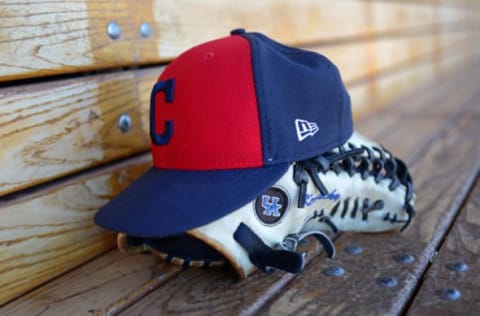 Mar 19, 2017; Goodyear, AZ, USA; A detailed view of a Cleveland Indians hat and glove before the game against the Arizona Diamondbacks at Goodyear Ballpark. Mandatory Credit: Jake Roth-USA TODAY Sports