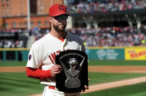 Apr 10, 2015; Cleveland, OH, USA; Cleveland Indians starting pitcher Corey Kluber (28) poses with the Cy Young Award before the game between the Cleveland Indians and the Detroit Tigers at Progressive Field. Mandatory Credit: Ken Blaze-USA TODAY Sports