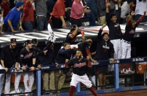 Nov 2, 2016; Cleveland, OH, USA; Cleveland Indians players including Carlos Santana celebrate a two-run home run by center fielder Rajai Davis (not pictured) against the Chicago Cubs in the 8th inning in game seven of the 2016 World Series at Progressive Field. Mandatory Credit: David Richard-USA TODAY Sports