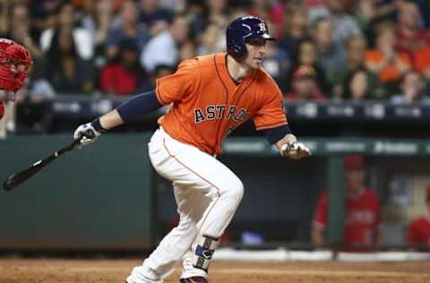 Sep 23, 2016; Houston, TX, USA; Houston Astros catcher Jason Castro (15) drives in a run with an infield single during the sixth inning against the Los Angeles Angels at Minute Maid Park. Mandatory Credit: Troy Taormina-USA TODAY Sports