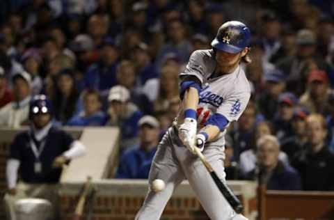 Oct 22, 2016; Chicago, IL, USA; Los Angeles Dodgers right fielder Josh Reddick (11) advances to first base on an error against the Chicago Cubs during the second inning of game six of the 2016 NLCS playoff baseball series at Wrigley Field. Mandatory Credit: Jon Durr-USA TODAY Sports