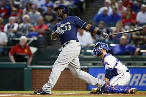 Sep 27, 2016; Arlington, TX, USA; Milwaukee Brewers first baseman Chris Carter (33) watches his two run home run in the first inning against the Texas Rangers at Globe Life Park in Arlington. Mandatory Credit: Tim Heitman-USA TODAY Sports