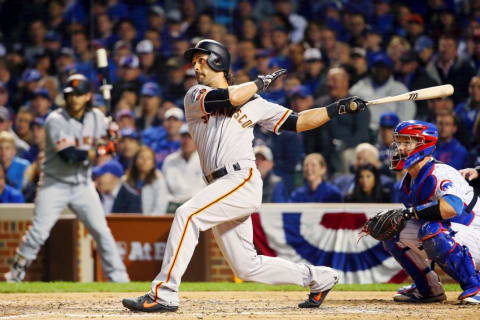 Oct 7, 2016; Chicago, IL, USA; San Francisco Giants left fielder Angel Pagan (16) hits a double against the Chicago Cubs during the fourth inning during game one of the 2016 NLDS playoff baseball series at Wrigley Field. Mandatory Credit: Jerry Lai-USA TODAY Sports