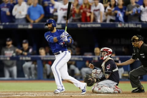 Oct 19, 2016; Toronto, Ontario, CAN; Toronto Blue Jays right fielder Jose Bautista (19) hits a double during the ninth inning against the Cleveland Indians in game five of the 2016 ALCS playoff baseball series at Rogers Centre. Mandatory Credit: John E. Sokolowski-USA TODAY Sports