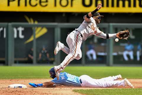 KANSAS CITY, MO – SEPTEMBER 2: Whit Merrifield #15 of the Kansas City Royals slides into second for a steal past shortstop Jonathan Villar #2 of the Baltimore Orioles in the third inning at Kauffman Stadium on September 2, 2018 in Kansas City, Missouri. (Photo by Ed Zurga/Getty Images)