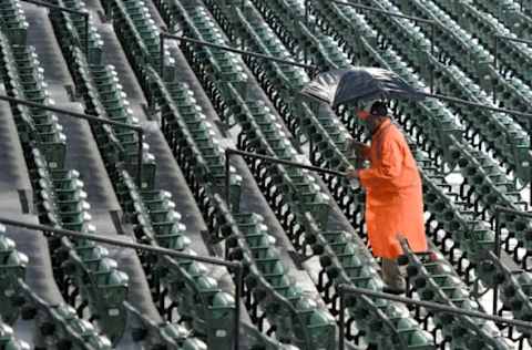 BALTIMORE, MD – SEPTEMBER 27: A security guard walks up the stairs after the baseball game between the Houston Astros and the Baltimore Orioles is canceled at Oriole Park at Camden Yards on September 27, 2018 in Baltimore, Maryland. (Photo by Mitchell Layton/Getty Images)