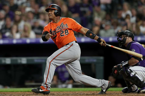 DENVER, COLORADO – MAY 25: Pedro Severino #28 of the Baltimore Orioles hits a single in the seventh inning to load the bases against the Colorado Rockies at Coors Field on May 25, 2019 in Denver, Colorado. (Photo by Matthew Stockman/Getty Images)