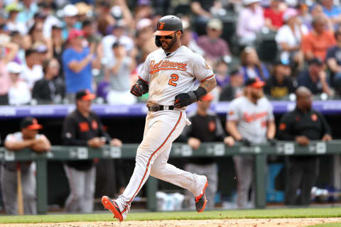 DENVER, COLORADO – MAY 26: Jonathan Villar #2 of the Baltimore Orioles scores on a Trey Mancini 2 RBI triple in the eighth inning against the Colorado Rockies at Coors Field on May 26, 2019 in Denver, Colorado. (Photo by Matthew Stockman/Getty Images)