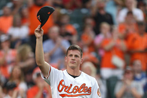 BALTIMORE, MARYLAND – JUNE 25: The 2019 top overall pick in the Major League Baseball draft, Adley Rutschman #35 of the Baltimore Orioles acknowledges the crowd during the fourth inning against the San Diego Padres at Oriole Park at Camden Yards on June 25, 2019 in Baltimore, Maryland. (Photo by Patrick Smith/Getty Images)