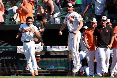 BALTIMORE, MD – AUGUST 11: Trey Mancini #16 and Richie Martin #1 of the Baltimore Orioles react after Rio Ruiz #14 hit a walk-off home run during the ninth inning against the Houston Astros at Oriole Park at Camden Yards on August 11, 2019 in Baltimore, Maryland. (Photo by Will Newton/Getty Images)