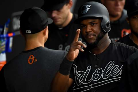 BALTIMORE, MD – AUGUST 24: Hanser Alberto #57 of the Baltimore Orioles celebrates after scoring on a wild pitch during the first inning against the Tampa Bay Rays at Oriole Park at Camden Yards on August 24, 2019 in Baltimore, Maryland. All players across MLB will wear nicknames on their backs as well as colorful, non-traditional uniforms featuring alternate designs inspired by youth-league uniforms during Players Weekend. (Photo by Will Newton/Getty Images)