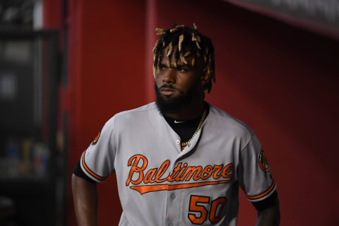 PHOENIX, ARIZONA – JULY 24: Miguel Castro #50 of the Baltimore Orioles reacts while walking through the dugout after being removed from the game during the seventh inning against the Arizona Diamondbacks at Chase Field on July 24, 2019 in Phoenix, Arizona. (Photo by Norm Hall/Getty Images)