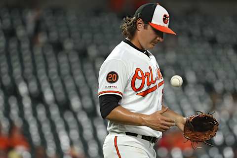 BALTIMORE, MARYLAND – AUGUST 22: Starting pitcher Asher Wojciechowski #29 of the Baltimore Orioles reacts after allowing a home run to Austin Meadows #17 of the Tampa Bay Rays (not pictured) during the third inning at Oriole Park at Camden Yards on August 22, 2019 in Baltimore, Maryland. (Photo by Patrick Smith/Getty Images)