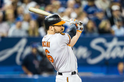 TORONTO, ONTARIO – SEPTEMBER 24: Trey Mancini #16 of the Baltimore Orioles hits an RBI single against the Toronto Blue Jays in the sixth inning during their MLB game at the Rogers Centre on September 24, 2019 in Toronto, Canada. (Photo by Mark Blinch/Getty Images)