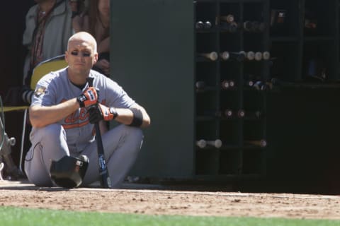 OAKLAND, CA – SEPTEMBER 5: Cal Ripken Jr. #8 of the Baltimore Orioles sits in the dugout during the game against the Oakland Athletics on September 5, 2001 at the Network Associaties Colesium in Oakland, California. The Athletics won 12-6. (Photo by Jed Jacobsohn/Getty Images)