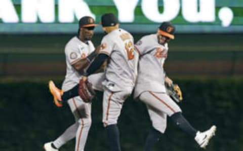 CHICAGO, ILLINOIS – JULY 13: (L-R) Jorge Mateo #3, Rougned Odor #12 and Ryan McKenna #26 of the Baltimore Orioles celebrate a 7-1 win over the Chicago Cubs at Wrigley Field on July 13, 2022 in Chicago, Illinois. (Photo by Nuccio DiNuzzo/Getty Images)