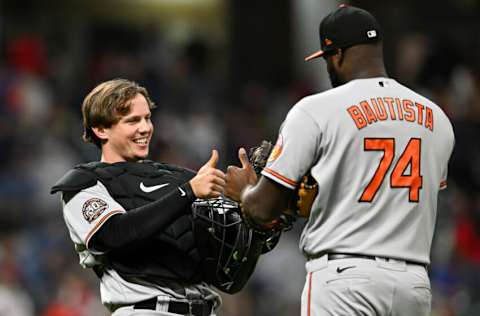 CLEVELAND, OH - SEPTEMBER 01: Adley Rutschman #35 and Félix Bautista #74 of the Baltimore Orioles celebrate the teams 3-0 win over the Cleveland Guardians at Progressive Field on September 01, 2022 in Cleveland, Ohio. (Photo by Nick Cammett/Getty Images)