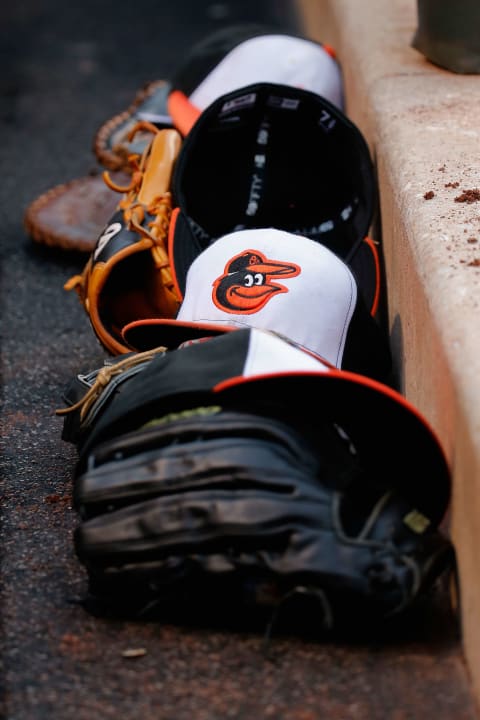 BALTIMORE, MD – JUNE 13: Gloves and hats line the Baltimore Orioles dugout during the Orioles 9-4 win over the New York Yankees at Oriole Park at Camden Yards on June 13, 2015 in Baltimore, Maryland. (Photo by Rob Carr/Getty Images)