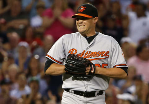 BOSTON, MA – JUNE 24: Pitcher Bud Norris #25 of the Baltimore Orioles reacts after committing an error on a bunt by Sandy Leon #3 of the Boston Red Sox during the sixth inning of the game at Fenway Park on June 24, 2015 in Boston, Massachusetts. (Photo by Winslow Townson/Getty Images)