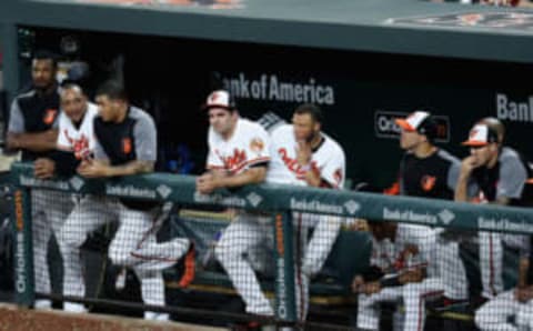 BALTIMORE, MD – JUNE 19: Members of the Baltimore Orioles look on from the dugout during the ninth inning of their 12-0 loss to the Cleveland Indians at Oriole Park at Camden Yards on June 19, 2017 in Baltimore, Maryland. (Photo by Rob Carr/Getty Images)