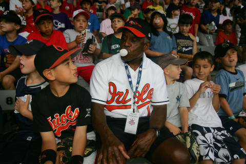 COOPERSTOWN, NY – JULY 27: Baseball legend Al Bumbry blows a bubble nwith a young fan during a rained-out coaching clinic held at Doubleday Field on July 27, 2007 in Cooperstown, New York. (Photo by Chris McGrath/Getty Images)