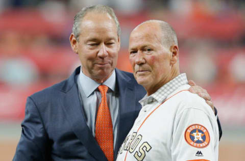 HOUSTON, TX – APRIL 03: Houston Astros owner Jim Crane presents retired first base coach Rich Dauer with his championship ring at Minute Maid Park on April 3, 2018 in Houston, Texas. Dauer almost died from a subdural hematoma during the championship parade. (Photo by Bob Levey/Getty Images)