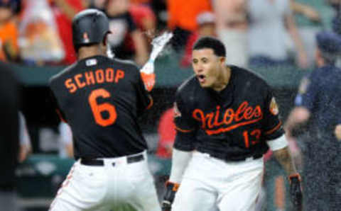 BALTIMORE, MD – AUGUST 18: Manny Machado #13 of the Baltimore Orioles celebrates with teammates after hitting the game winning grand slam in the ninth inning against the Los Angeles Angels at Oriole Park at Camden Yards on August 18, 2017 in Baltimore, Maryland. Baltimore won the game 9-7. (Photo by Greg Fiume/Getty Images)