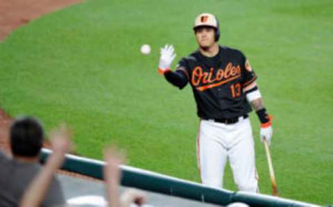 BALTIMORE, MD – JUNE 16: Manny Machado #13 of the Baltimore Orioles tosses a ball to the fans in the sixth inning of the game against the St. Louis Cardinals at Oriole Park at Camden Yards on June 16, 2017 in Baltimore, Maryland. (Photo by Greg Fiume/Getty Images)