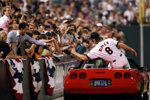 6 Sep 1995: Shortstop Cal Ripken of the Baltimore Orioles shakes hands with fans at Camden Yards in Baltimore, Maryland to acknowledge congratulations for breaking Lou Gehrig”s record for consecutive games played. The game was against the California Angels and the Orioles won 4-2. Mandatory Credit: Doug Pensinger /Allsport