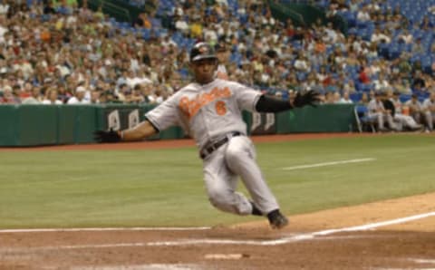 Baltimore Orioles Melvin Mora slides into home plate against the Tampa Bay Devil Rays July 23, 2006 in St. Petersburg. The Orioles defeated the Rays 4 – 2. (Photo by Al Messerschmidt/WireImage)