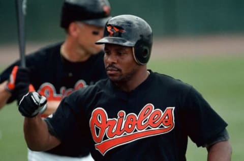 Baltimore Orioles’ player Albert Belle is greeted by teammates after hitting a homerun in the second inning against the Minnesota Twins 18 March 2000 in Fort Lauderdale, Florida. Baltimore beat Minnesota 3-2. AFP PHOTO/HEATHER HALL (Photo by HEATHER HALL / AFP) (Photo by HEATHER HALL/AFP via Getty Images)