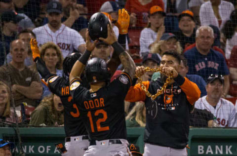 BOSTON, MA – MAY 27: Jorge Mateo #3 of the Baltimore Orioles celebrates his 2-run home run against the Boston Red Sox with teammate Rougned Odor #12 as he receives a huge chain in the dugout during the seventh inning at Fenway Park on May 27, 2022 in Boston, Massachusetts. (Photo by Rich Gagnon/Getty Images)