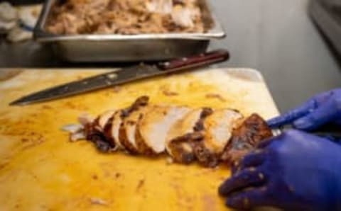 NEW YORK, NEW YORK – NOVEMBER 26: A chef carves a turkey for Rosa Mexicano’s Thanksgiving dinner near Lincoln Center on November 26, 2020 in New York City. The pandemic continues to burden restaurants and bars as businesses struggle to thrive with evolving government restrictions and social distancing plans which impact keeping businesses open yet challenge profitability. (Photo by Alexi Rosenfeld/Getty Images)