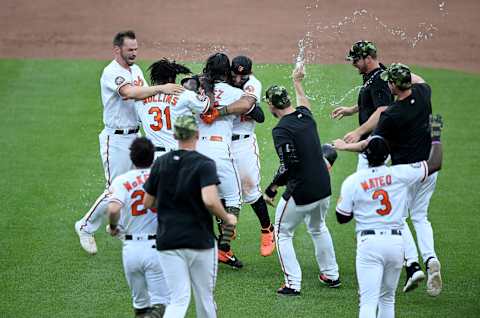 Rougned Odor #12 of the Baltimore Orioles celebrates with teammates after driving in the game-winning run. (Photo by Greg Fiume/Getty Images