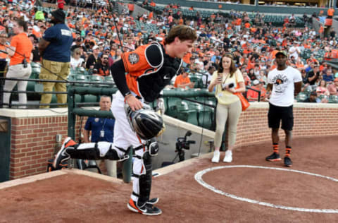 BALTIMORE, MARYLAND – MAY 21: Adley Rutschman #35 of the Baltimore Orioles takes the field in the first inning for the first time in his Major League debut against the Tampa Bay Rays at Oriole Park at Camden Yards on May 21, 2022 in Baltimore, Maryland. (Photo by G Fiume/Getty Images)