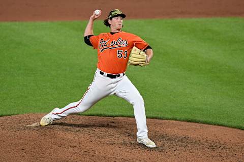 BALTIMORE, MARYLAND – MAY 21: Mike Baumann #53 of the Baltimore Orioles pitches against the Tampa Bay Rays at Oriole Park at Camden Yards on May 21, 2022, in Baltimore, Maryland. (Photo by G Fiume/Getty Images)