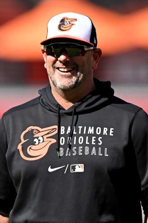 BALTIMORE, MARYLAND – AUGUST 20: Brandon Hyde #18 of the Baltimore Orioles looks on before the game between the Baltimore Orioles and the Boston Red Sox at Oriole Park at Camden Yards on August 20, 2022 in Baltimore, Maryland. (Photo by G Fiume/Getty Images)