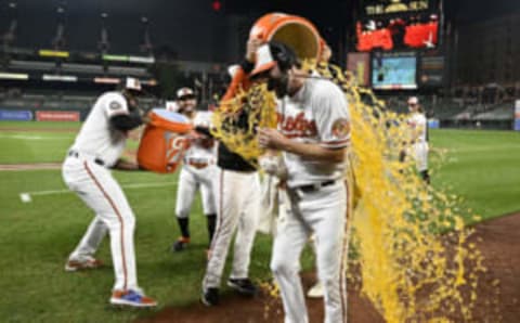 BALTIMORE, MARYLAND – SEPTEMBER 21: Jordan Lyles #28 of the Baltimore Orioles gets doused with Gatorade after pitching a complete game against the Detroit Tigers at Oriole Park at Camden Yards on September 21, 2022 in Baltimore, Maryland. Baltimore won the game 8-1. (Photo by Greg Fiume/Getty Images)