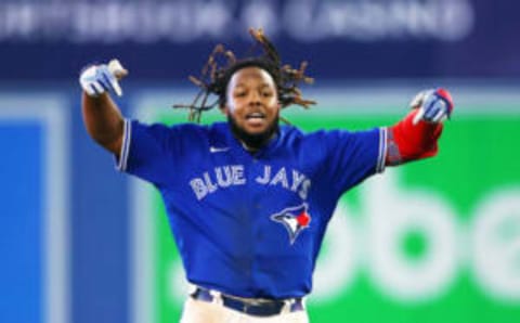 TORONTO, ON – SEPTEMBER 26: Vladimir Guerrero Jr. #27 of the Toronto Blue Jays celebrates his walk-off RBI single in the tenth inning against the New York Yankees at Rogers Centre on September 26, 2022 in Toronto, Ontario, Canada. (Photo by Vaughn Ridley/Getty Images)