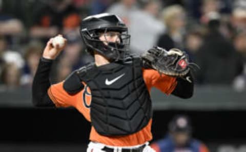 BALTIMORE, MARYLAND – SEPTEMBER 24: Adley Rutschman #35 of the Baltimore Orioles throws the ball to second base against the Houston Astros at Oriole Park at Camden Yards on September 24, 2022 in Baltimore, Maryland. (Photo by G Fiume/Getty Images)